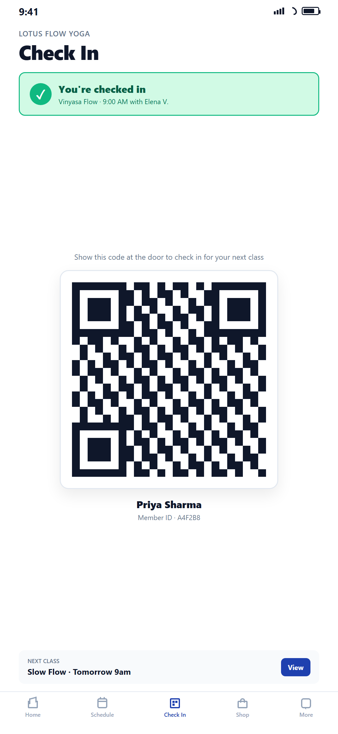 QR check-in screen at a yoga studio with success confirmation and next class